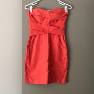 Coral strapless dress with pockets